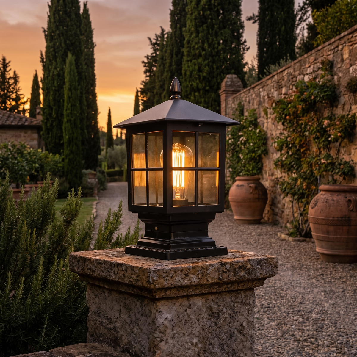 Stone pillar light beside a Tuscan villa garden path
